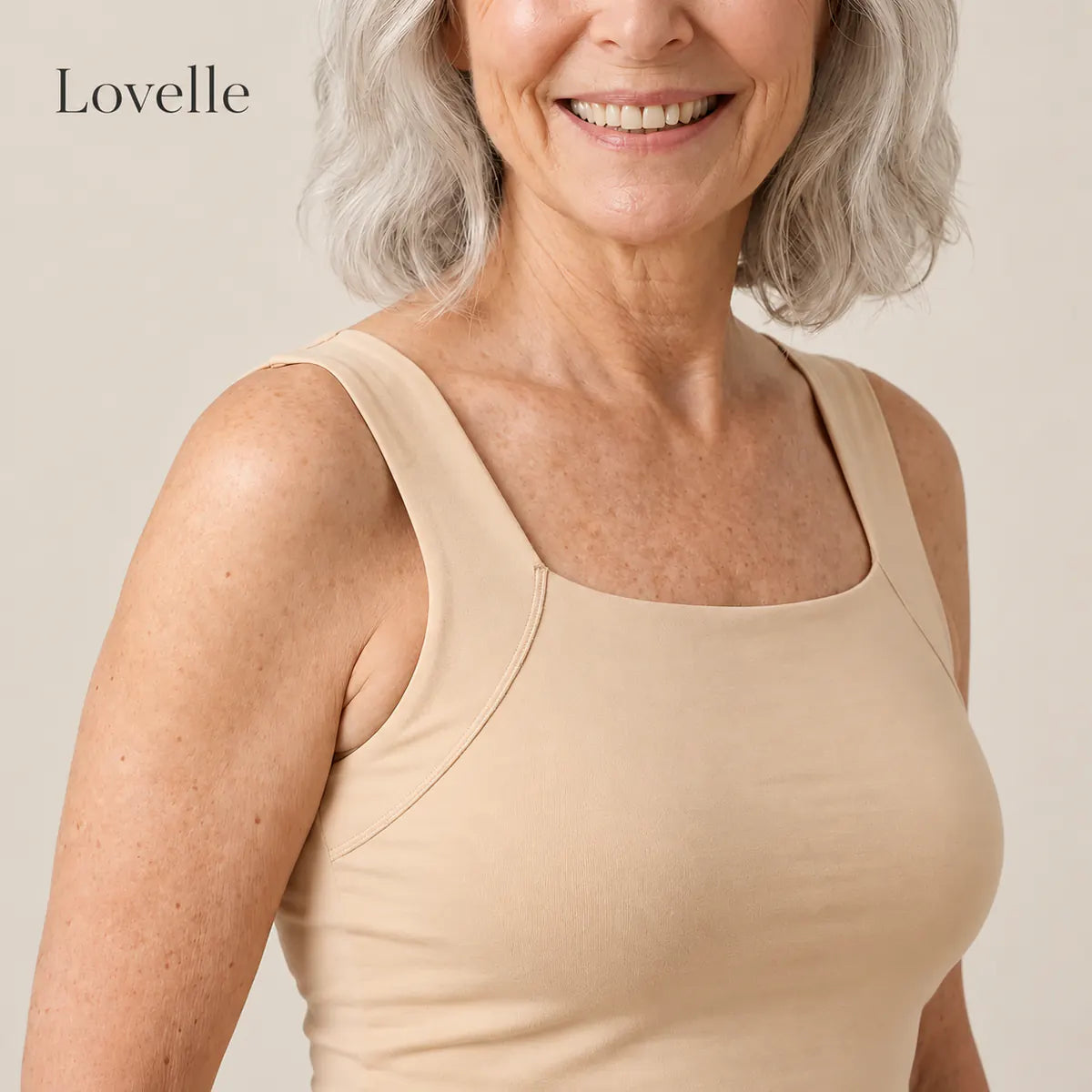 Lovelle Ease built-in bra tank in nude from the front with four marked details: straps, neckline, support layer and outer layer