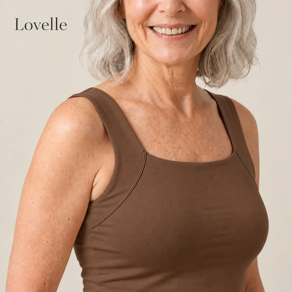 Smiling silver-haired woman wearing the Lovelle Ease built-in bra tank in coffee, square neckline and wide straps