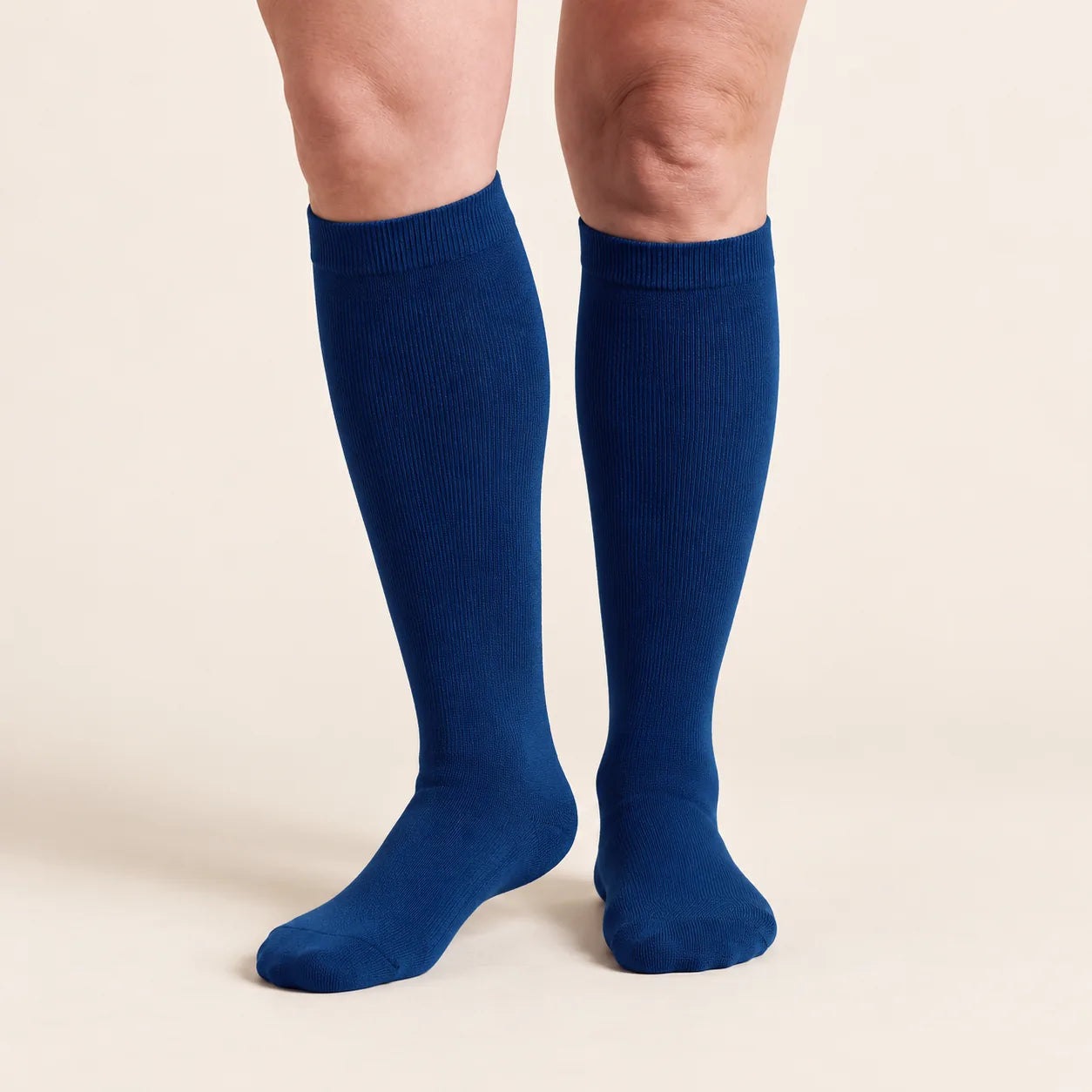 Lovelle Lift compression socks in navy from the front with four marked zones: cuff, calf, ankle and foot